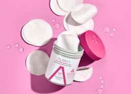 a container of toner pads on a pink background