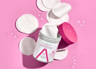 a container of toner pads on a pink background