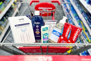 shopping cart with personal care items by colgate, smile direct club, goodline, and tom's
