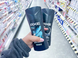 hand holding axe body wash in walgreens