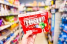 hand holding m&m's share size candies