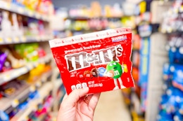 hand holding m&m's share size candies