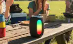 portable bluetooth speaker on picnic table
