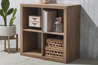 lifestyle image of a brown wood cube storage organizer