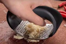 someone mincing garlic