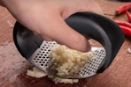 someone mincing garlic