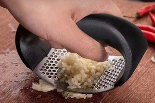 someone mincing garlic