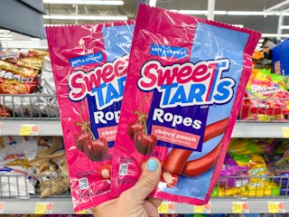 hand holding two sweetarts ropes at Walmart