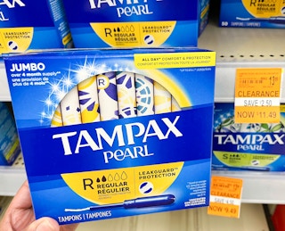 a person holding up tampax pearls