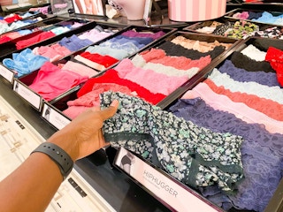 hand holding Victoria's Secret underwear