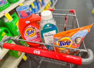 one bottle of Tide liquid detergent, Downy Rinse and Refresh, and one pack of Tide pods inside shopping cart