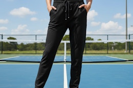 a woman wearing joggers outside