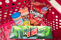 mountain dew soda, skippy peanut butter, dunkin coffee, doritos, and crayola crayons in a cart