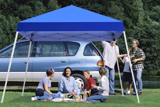 a family near a canopy tent
