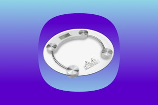 Digital bathroom scale over blue single image background