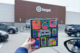 person holding a needoh halloween advent calendar in front of target