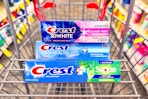3 tubes of crest toothpaste in a cart