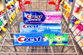 3 tubes of crest toothpaste in a cart