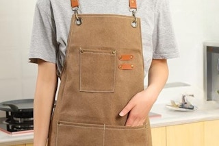 Woman wearing cross back apron.