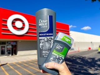 hand holding a bottle of dove men care body wash and deodorant beastmode in front of target store