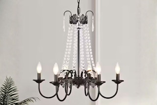 Lifestyle image of the Adsensty Chandelier with crystal detailing and candle-style light bulbs