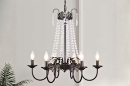 Lifestyle image of the Adsensty Chandelier with crystal detailing and candle-style light bulbs