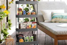 a 4-tier rolling cart next to patio furniture