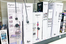 dyson vacuums sitting on a target shelf