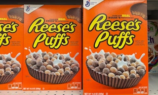 A row of Reese's puffs cereal on a store shelf.