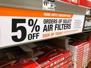 Air filters on the shelf at home depot with a notice that these are available for subscriptions at 5% off.