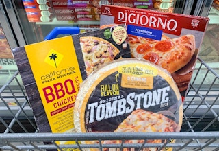 tombstone california pizza kitchen digiorno frozen pizzas in a small walmart cart in front of frozen pizza aisle at walmart