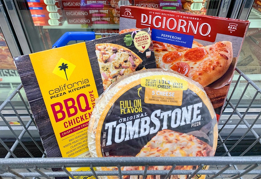 tombstone california pizza kitchen digiorno frozen pizzas in a small walmart cart in front of frozen pizza aisle at walmart