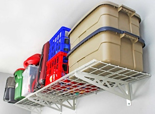 storage containers and baskets on a sferacks shelf mounted to a wall
