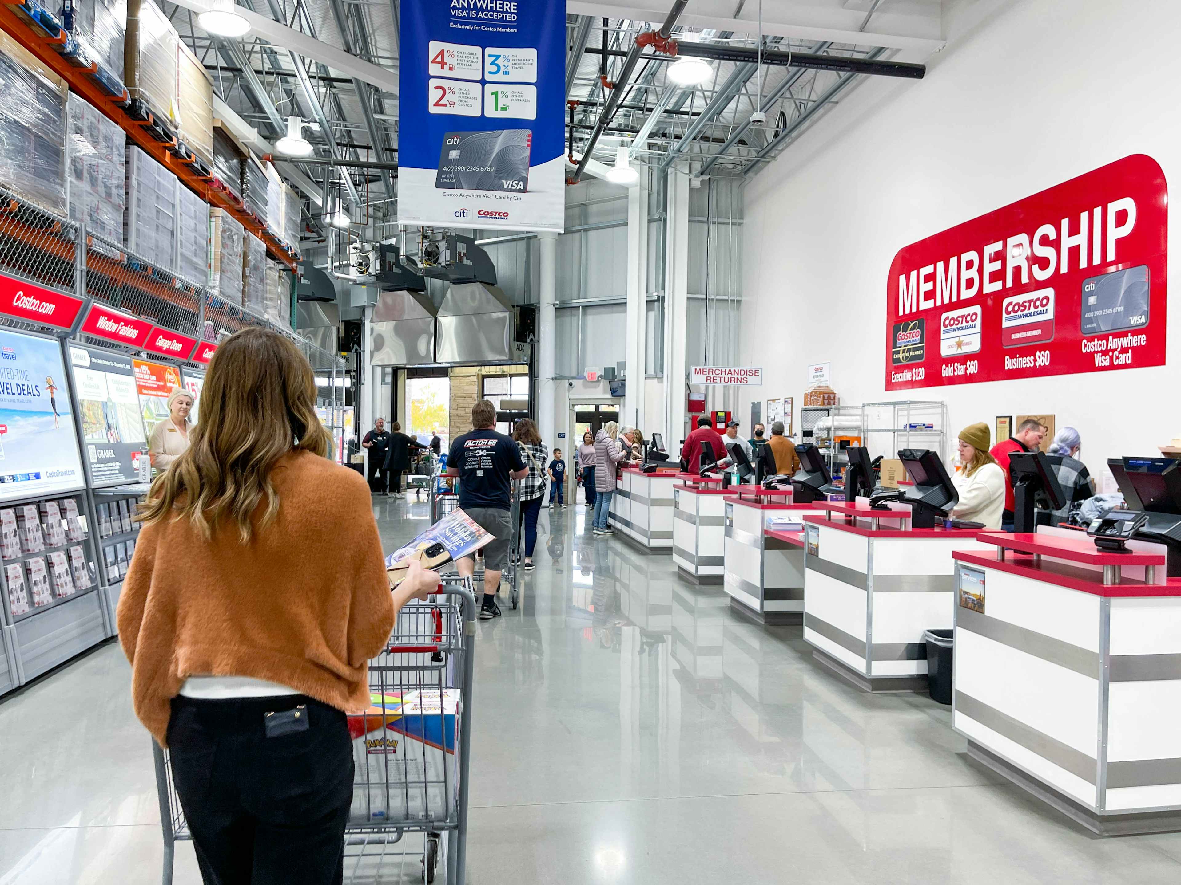 a person pushing a cart and shopping at costco 