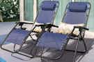 2 navy blue anti gravity chairs set on a patio