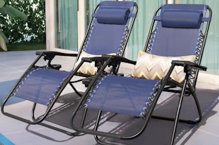 2 navy blue anti gravity chairs set on a patio