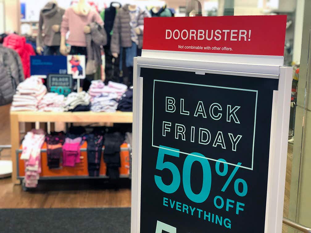 A sign in front of Gap that reads, "Black Friday 50% off everything.