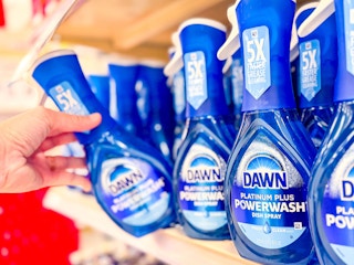 hand grabbing a powerwash dish spray off a target shelf