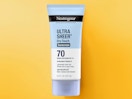 a tube of sunscreen on a yellow background