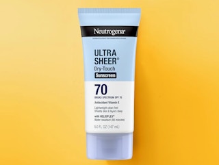 a tube of sunscreen on a yellow background
