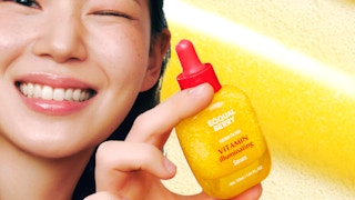 a yellow and red bottle of face serum