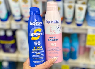 coppertone sunscreen held in hand