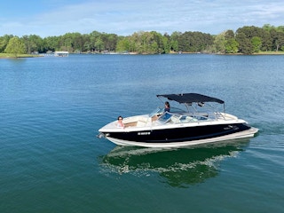 people on a boat in a lake