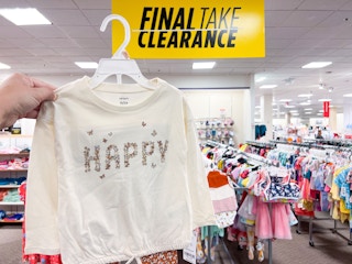 hand holding up clearance carter's sweater at jcpenney