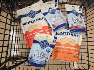 5 bags of blue buffalo dog treats in a cart