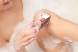 a woman using a trimmer