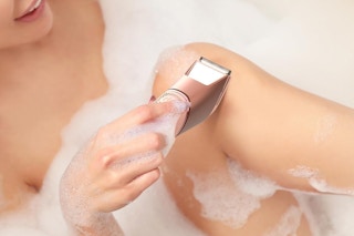 a woman using a trimmer