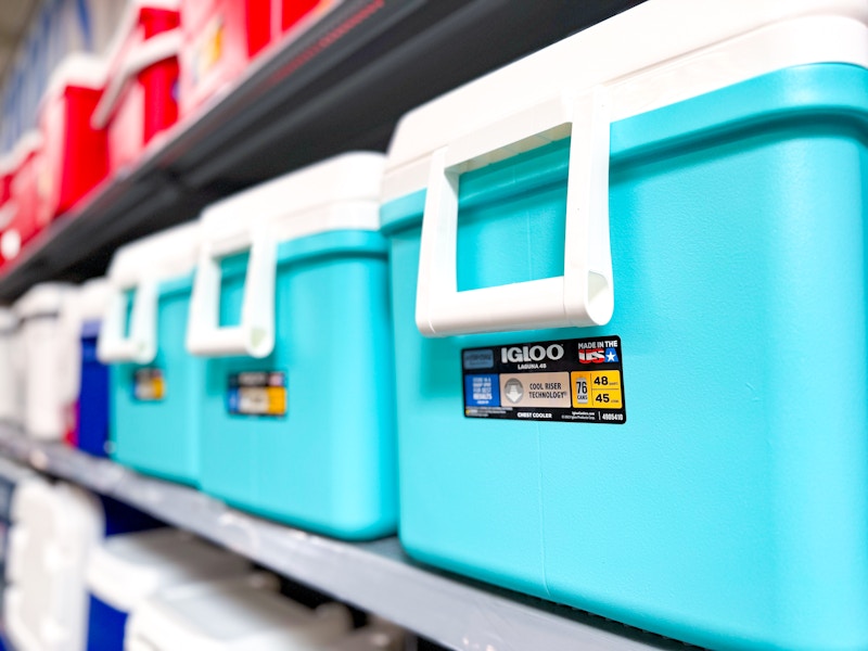 teal igloo coolers on a shelf