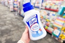 person holding a bottle of lysol laundry sanitizer