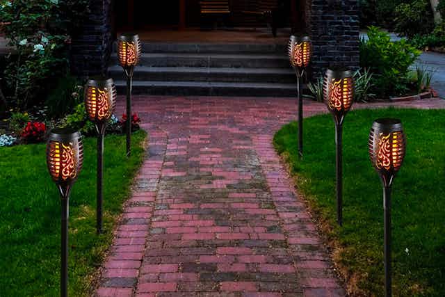Solar 12-Pack Flickering Tiki Torch LED Lights, $43.99 Shipped card image
